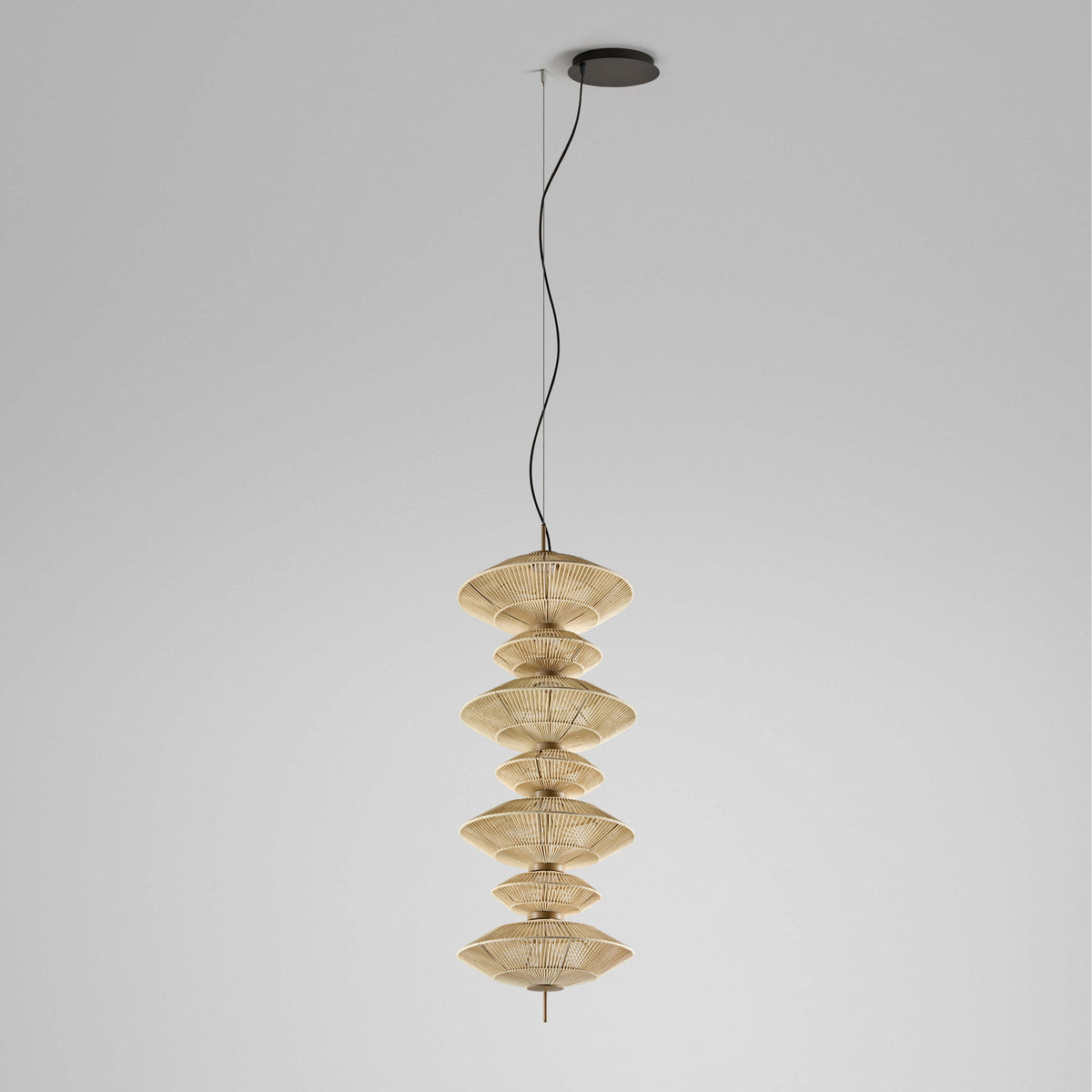Yuyun S/7C fabric LED pendant light with seven stacked round woven tiers in satin beige on a slim stem, suspended from a black ceiling canopy against a plain grey background.