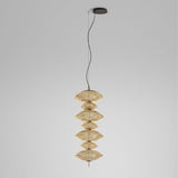 Yuyun S/7C fabric LED pendant light with seven stacked round woven tiers in satin beige on a slim stem, suspended from a black ceiling canopy against a plain grey background.