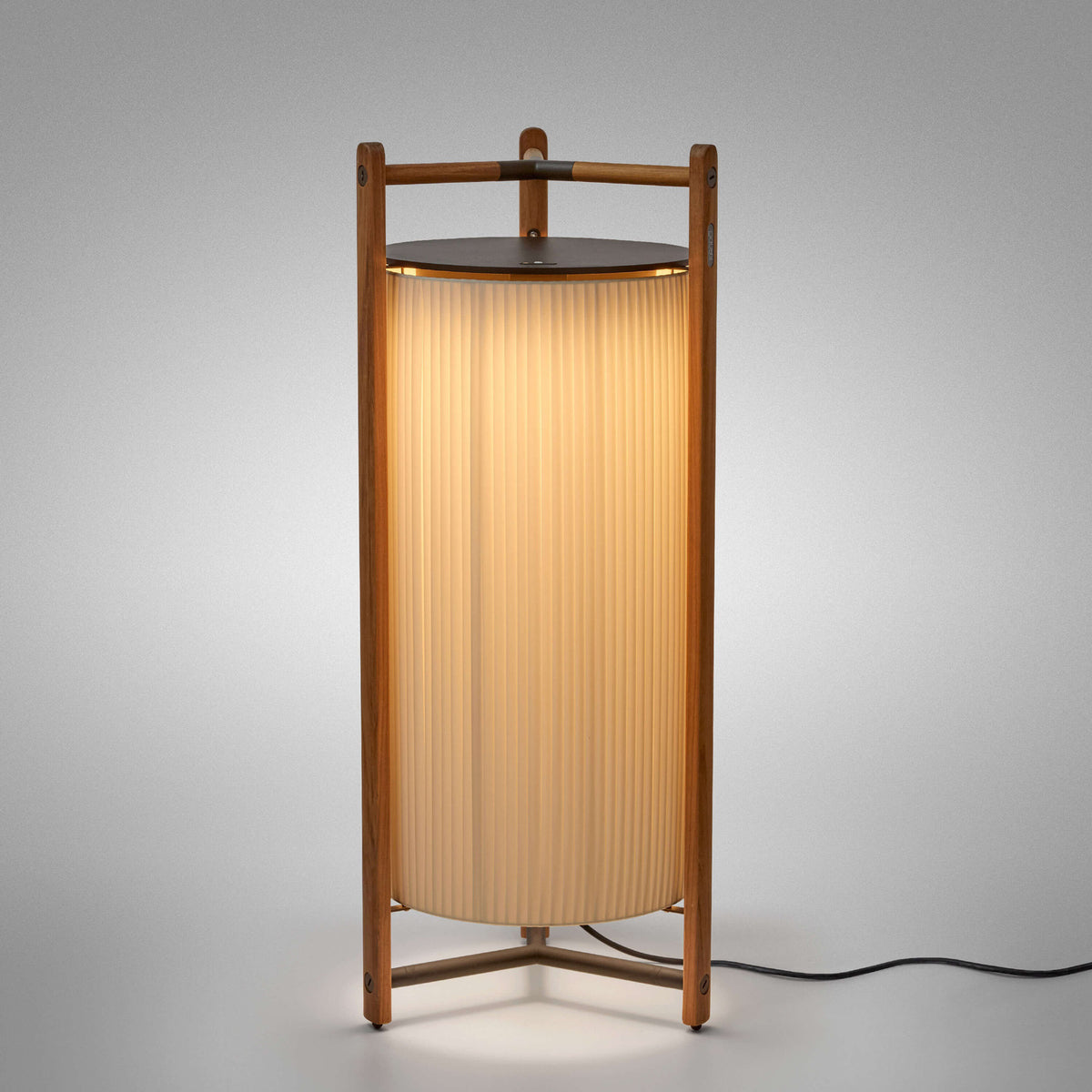 Kando P/111 Ribbon LED floor lamp with a tall pleated cream shade inside an open teak wood frame and dark top disc, on a plain light background.