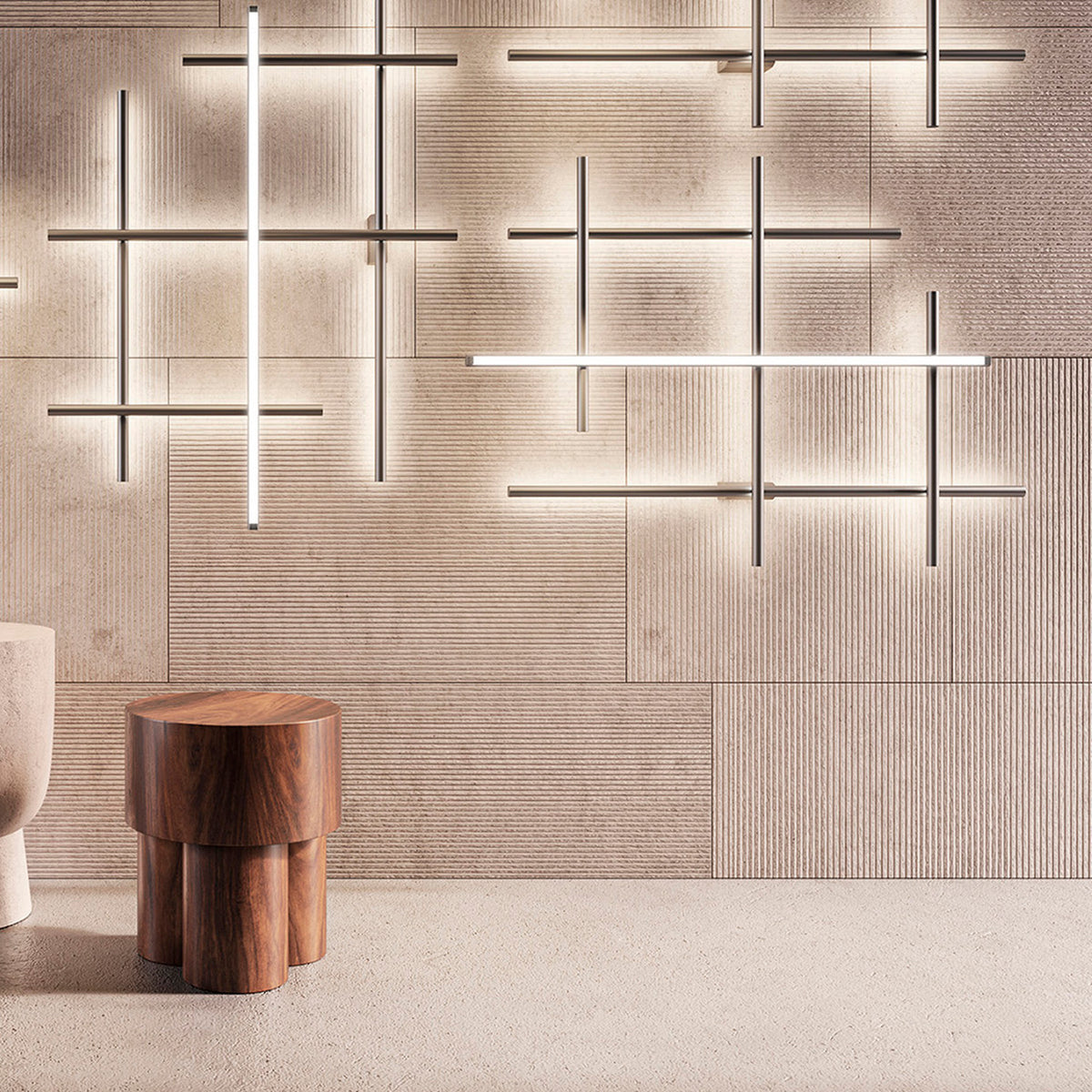 Hilow Black Diffuser Frame LED wall lights in Brushed Bronze, multiple criss-crossing linear fixtures installed on a textured panelled wall above a wooden stool.