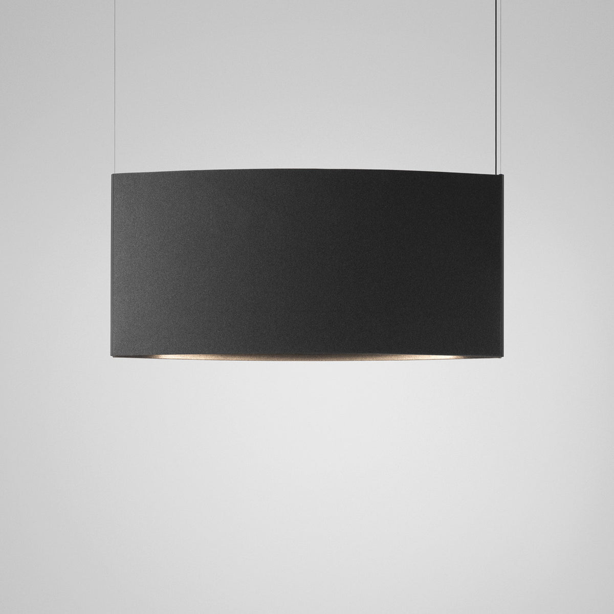 Noren S/151.2 fabric LED pendant light with a curved dark grey panel shade, hung on two fine cables from a slim ceiling canopy against a plain light background.