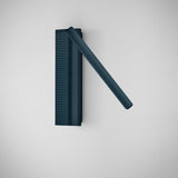 Arid A/03 LED wall light with ribbed rectangular backplate and angled tube in Textured Grey Blue aluminium finish, shown on a plain white background.