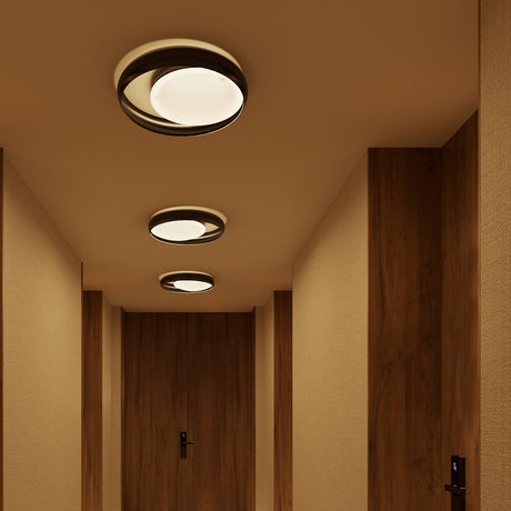 Ring C45 Glass Ring Ceiling Light in black finish, flush-mount design with offset ring frame and glowing round disc, shown in three sizes along a wood-panelled hallway.