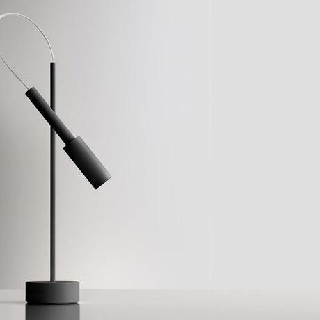 Tubino Aluminium LED Table Lamp in matt black, with a slender upright stem, round base, angled cylindrical head and looped cable, shown against a plain light grey background.