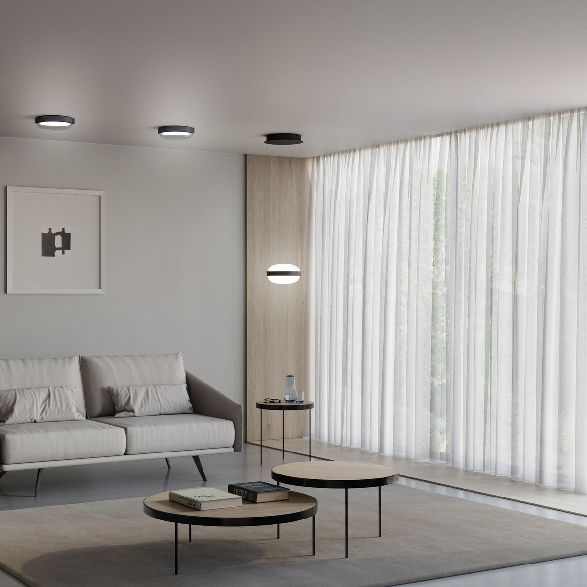 Beaded C round flush ceiling lights in black with curved opal glass diffusers, shown on a grey ceiling and as a matching wall light in a modern living room.