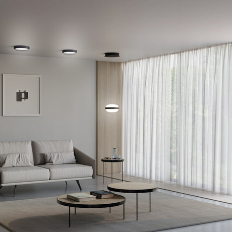 Beaded C round flush ceiling lights in black with curved opal glass diffusers, shown on a grey ceiling and as a matching wall light in a modern living room.