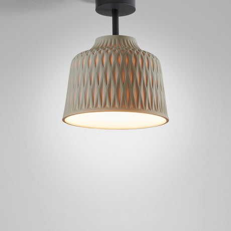 Soft PF/30 Bell outdoor ceiling light in Olive Grey, bell-shaped shade with raised diamond pattern, black stem and canopy, glowing base, shown on a plain light grey background.