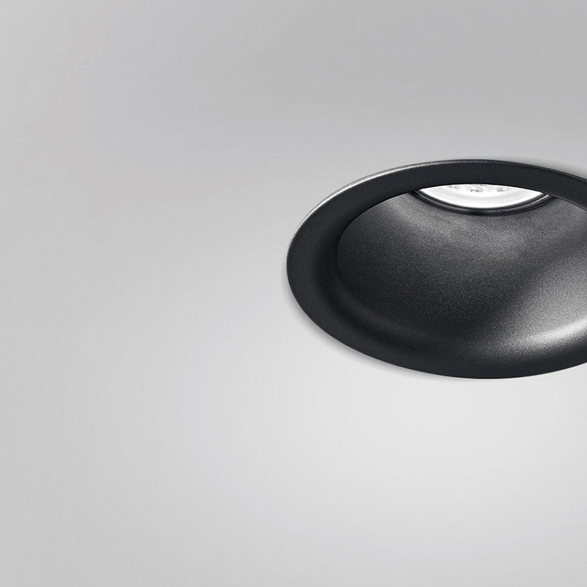 Joe Aluminium Round Recessed LED Downlight 9cm in black, shown close-up with deep flared trim and recessed bulb, against a plain light grey background.