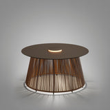 Nit/80/R rechargeable outdoor table lamp with round stone-brown top, woven synthetic fibre drum base, and integrated LED ring glowing through the cords, shown on a plain grey background.