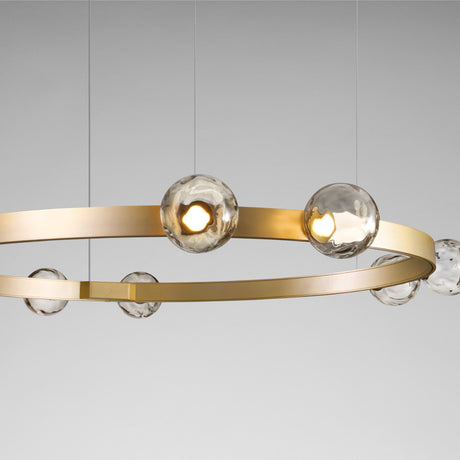 Murané R ring chandelier in Brushed Champagne finish, 110cm band with integrated LED and Smoke Grey glass spheres set above and below the ring, shown against a plain grey background.