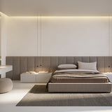 Rendez-vous Cone LED pendant lights in matt black, two small cone heads suspended on fine cables above bedside nightstands in a modern bedroom.