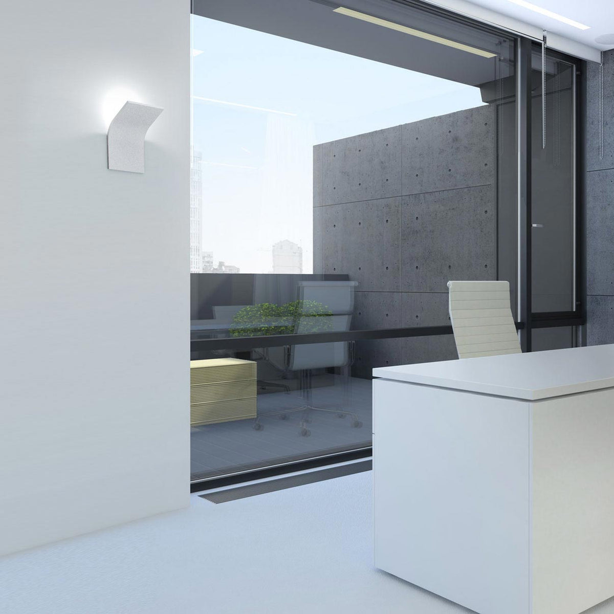 App Aluminium LED Wall Light in white, its curved panel mounted on an office wall near a glass sliding door, desk and chair visible in the room.