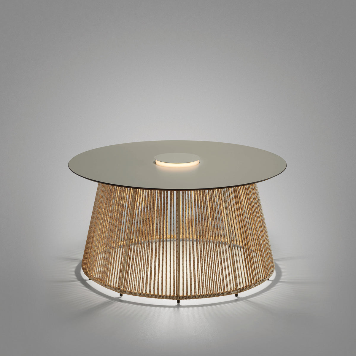 Nit/80/R Woven Rechargeable Outdoor Table Lamp in ivory and beige, round tabletop with central integrated LED light ring on a woven cord drum base, shown on a plain grey background.