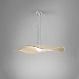 Mediterrània S/105 Ribbon LED pendant light with a wide, pleated cream translucent shade curving in a soft wave, suspended from a white ceiling canopy against a plain grey background.