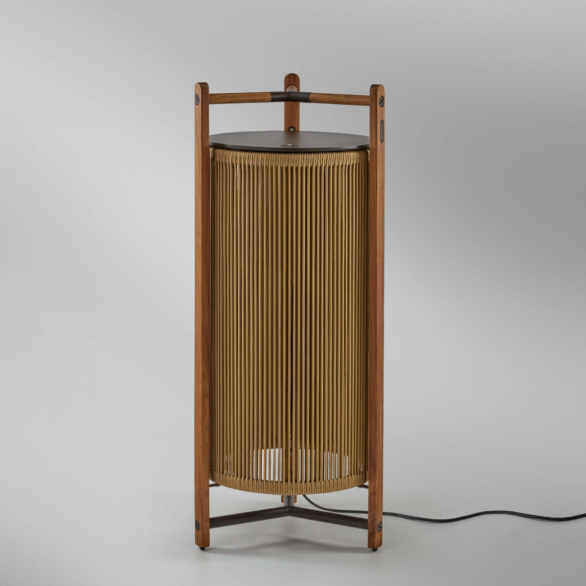 Kando P/111 outdoor floor lamp with teak wood frame and sand nautical cord cylindrical shade, integrated LED, dark top disc, shown on a plain light background.
