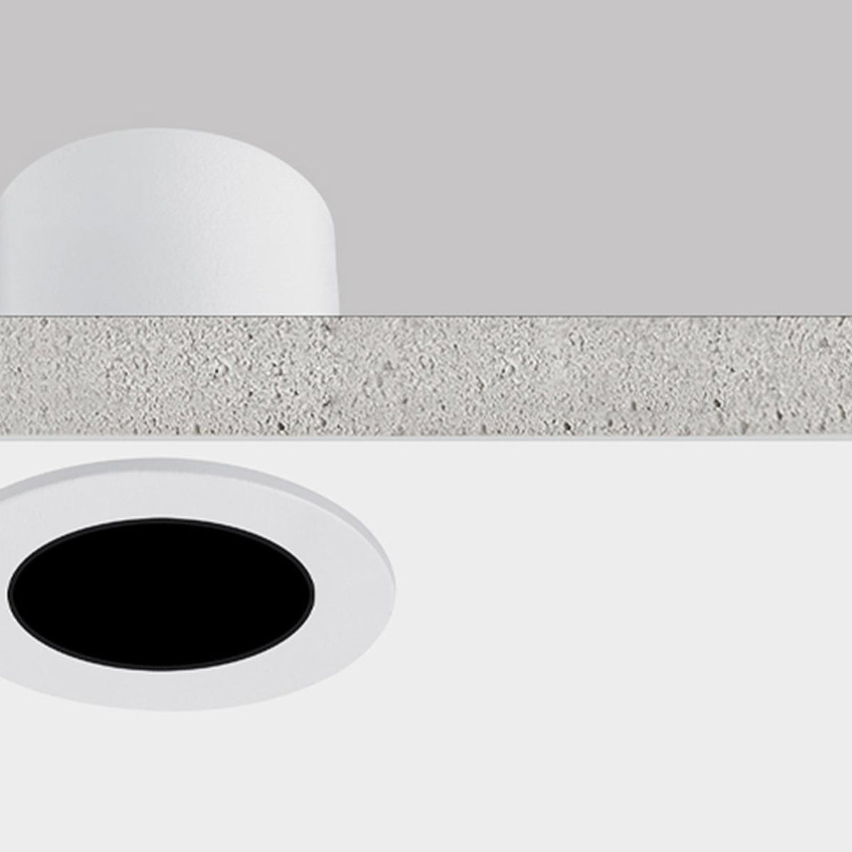 Nick Aluminium Round Recessed LED Downlight 5cm in white, shown in cross-section with ceiling plaster, round white trim, black interior, and integrated LED, warm white 3000K.