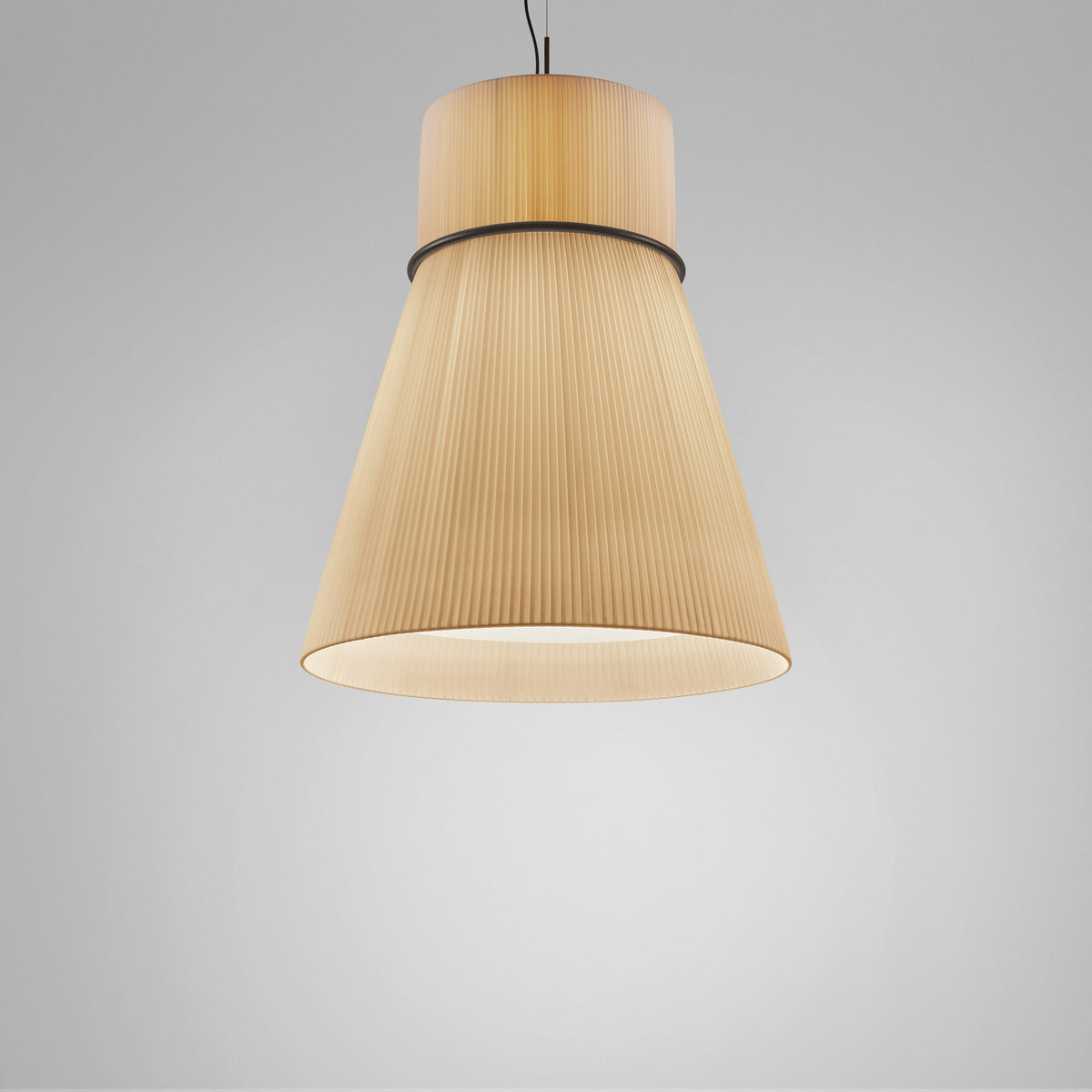 Folie S/70 Ribbon Cone pendant light with a cream pleated fabric shade, cylinder-over-cone shape and black ring join, shown on a plain grey background.