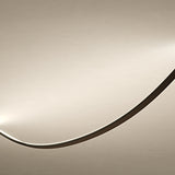 Bow LED Module Kit 50cm, a slim curved light profile in dark finish glowing along one edge, shown close-up against a plain light background.