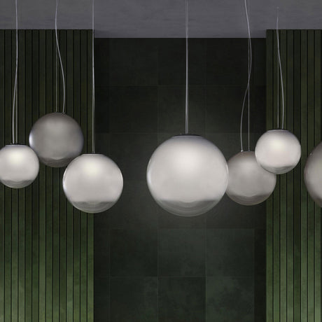 Smoke Glass Globe LED Pendant Light, 35cm sphere in graded smoky grey glass, shown grouped with varying globe sizes against a dark panelled wall.