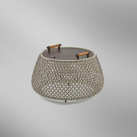 Nans Bag/38/R rechargeable outdoor floor lamp, low rounded drum with woven brown, beige and light grey lattice shade, flat dark lid and two teak wood handles, on a plain light background.