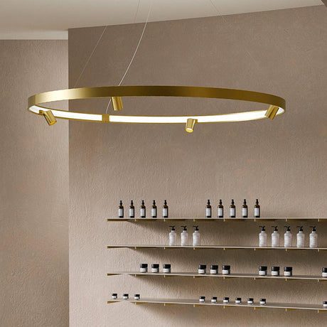 Arena Aluminium Ring LED Pendant Light, 194cm circular design in Brushed Bronze with integrated LED ring and small spot heads, shown suspended above open shelving in a retail setting.