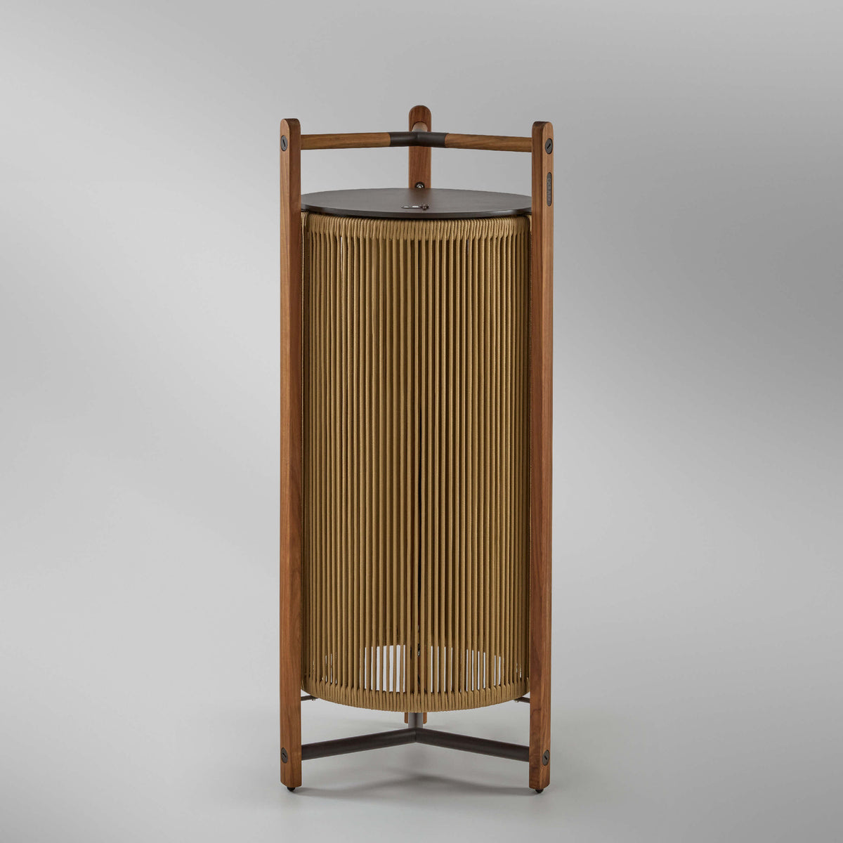 Kando P/111/R rechargeable outdoor floor lamp with teak wood frame, sand nautical cord cylinder shade, brown top disc and three-legged base, on a plain white background.