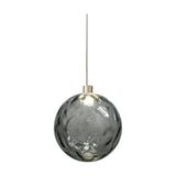Murané pendant light with a 15cm rippled Smoke Grey glass sphere, Brushed Champagne cylinder mount, integrated LED, and slim cable on a plain white background.