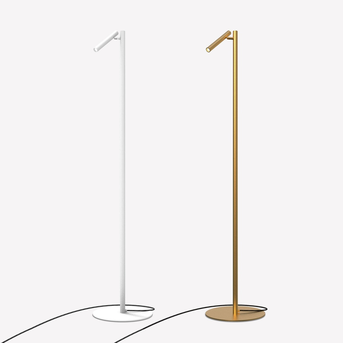 Rui LED Reading Floor Lamp in matt white, slim pole on round disc base with tubular pivoting shade, shown beside a matching brass-finish version on a plain light background.