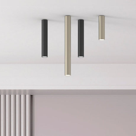 Rose Cylinder Recessed Downlight in matt polished brass, shown among black and brass ceiling-mounted cylinder downlights of varying lengths against a white ceiling.