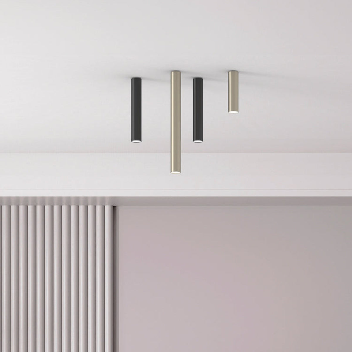 Ceiling-mounted Rose Cylinder downlights in black and matt polished brass finishes, slim tube design with GU10 lamps, shown against a white ceiling above a panelled interior.