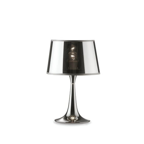 The Arc Small Table Lamp in chrome boasts a sleek design with a glossy metallic finish and a clear conical shade that elegantly displays the bulb. Ideal for modern lighting, its slender curved base adds minimalist charm to industrial interiors, exuding elegance.