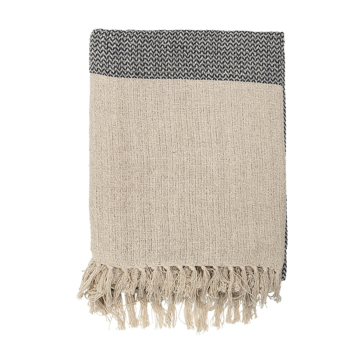Matt Throw in beige, folded flat with a plain open weave body, a charcoal flecked zigzag border, and long loose fringe, shown on a white background.
