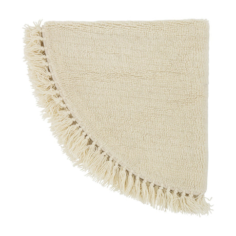 Lenea Round Wool Rug 110cm in natural, with a nubbly woven pile and loose fringe trim around the edge, shown folded on a white background.