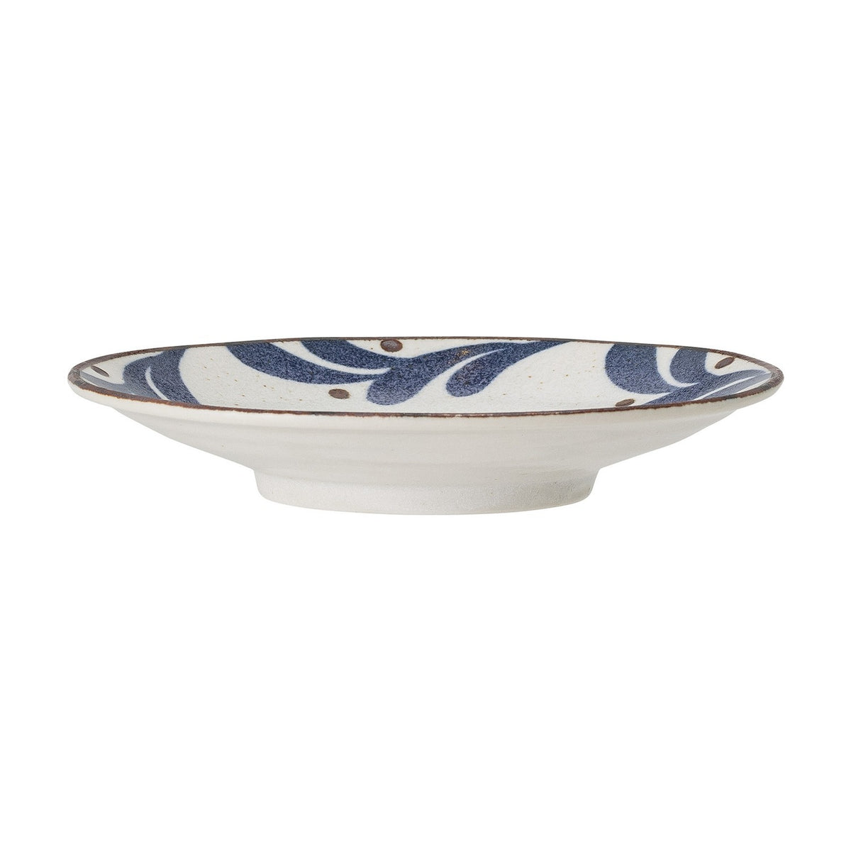 Camellia Porcelain Plate in cream, shown side-on with a footed base and a rim border of blue leaf shapes and dots on a plain white background.