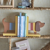 Charlie Dog Bookends Set of 2 in multicoloured MDF, shaped as a dog's head and tail, holding children's books upright on a shelf.