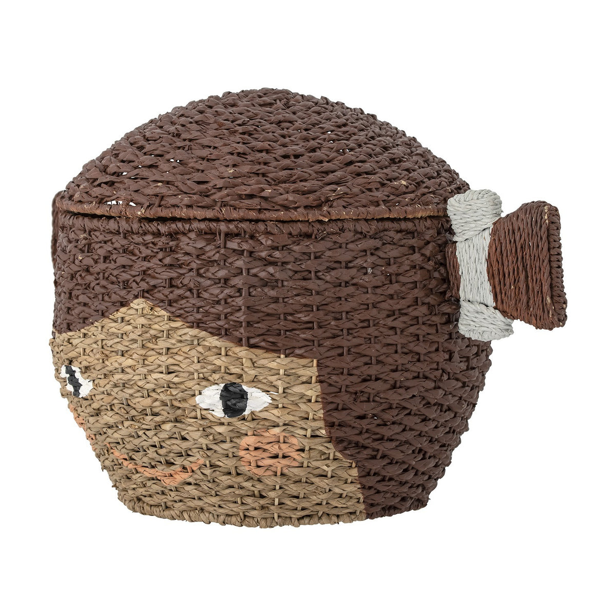Lill Basket with Lid in brown, a Bankuan grass woven storage basket shaped like a smiling face with a lidded hair bun tied at the side, shown on a white background.