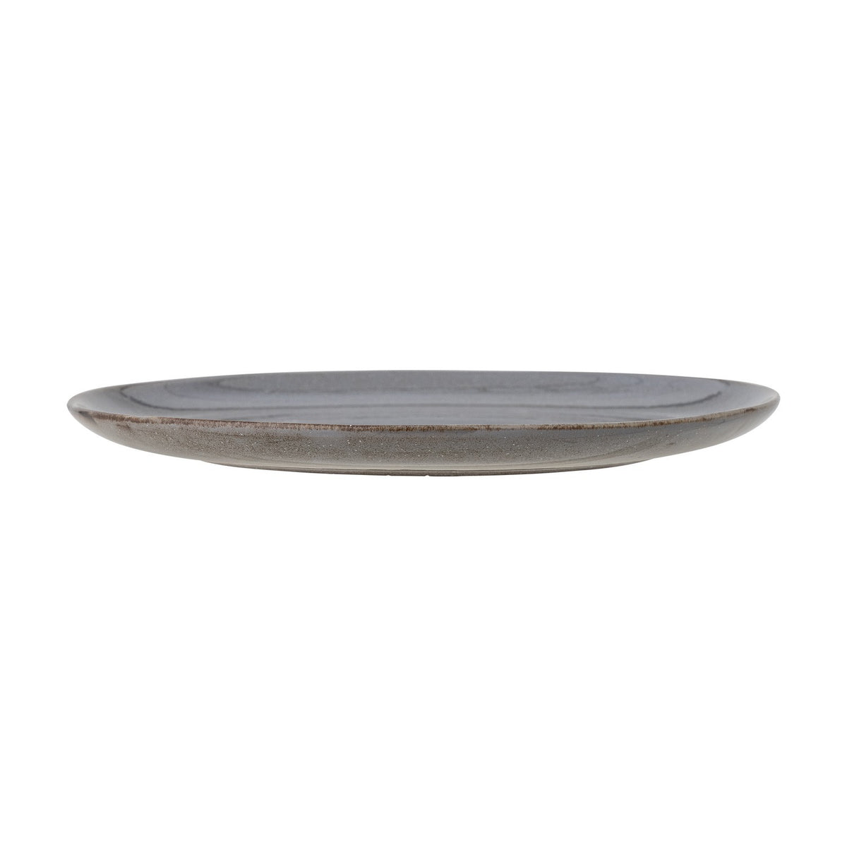 Side view of the Sandrine Stoneware Dinner Plate in grey, showing its low flat profile and raised rim with a reactive speckled glaze, against a plain white background.