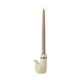 Trudy Bird Stoneware Candle Holder in cream, shaped like a bird with painted wing and beak detail, holding a tall tapered candle, on a plain white background.