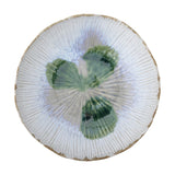 Mati Fluted Stoneware Bowl 29cm in white, a wide shallow dish with ribbed fluting radiating to an uneven rim and a green floral glaze pattern at the centre, shown on a plain white background.