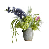 Poetry Artificial Bouquet in Green, featuring green hydrangea heads, dark veined orchid sprays, an anthurium, ferns and trailing foliage in a patterned ceramic pot on a white background.