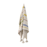 Pontino Striped Cotton Throw in cream, hanging with multicoloured woven stripes and tasselled corners against a plain white background.
