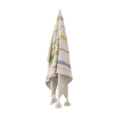 Pontino Striped Cotton Throw in cream, hanging with multicoloured woven stripes and tasselled corners against a plain white background.