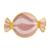 Caramella Wrapped Sweet stoneware platter in pink, shaped like a twisted sweet wrapper with hand-painted pink swirls and striped yellow-edged ends, on a white background.