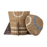 Space Rocket Rattan Basket with Lid in natural woven rattan, with pointed nose lid, triangular fins, and blue porthole ring detail, shown against a white background.