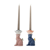 Eri Cat Stoneware Candle Holders, Set of 2, seated cat figures in pink stripes and navy dots with flower-shaped candle cups and perched bird details, tall taper candles, plain white background.