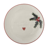 Cream stoneware Christmas side plate with pink rim, embossed "Have a Holly Jolly Christmas" text, a red heart, and a painted holly sprig with berries, shown on a plain white background.