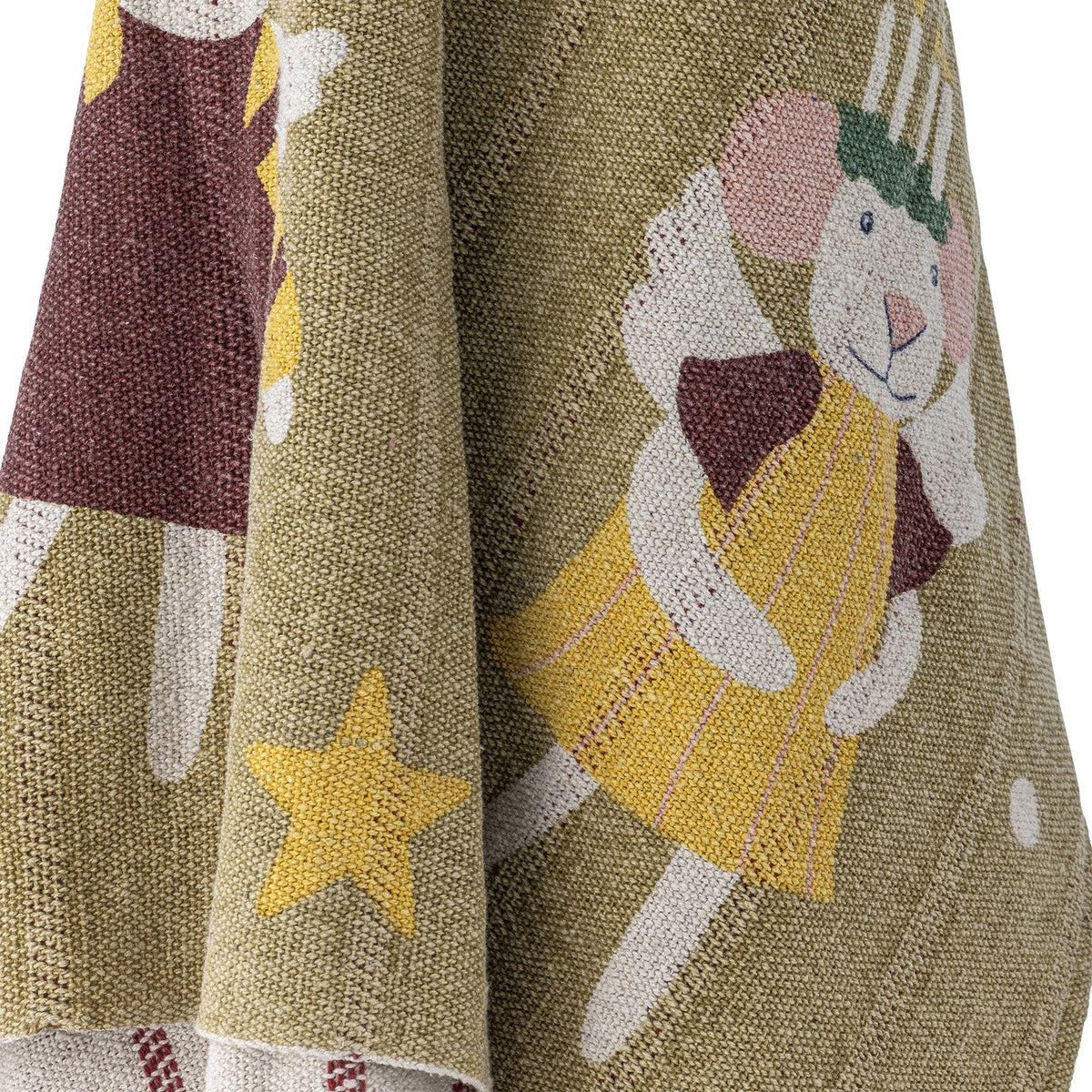 Peo Striped Christmas Throw in green, knitted fabric draped to show a mouse-in-angel-dress motif with stars among the woven texture.