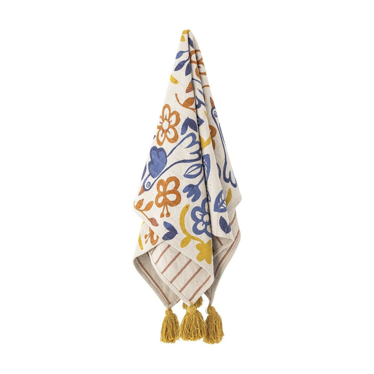 Figuria Cotton Throw in multicoloured floral, leaf and bird print with striped reverse and mustard tassel corners, shown hanging against a plain white background.