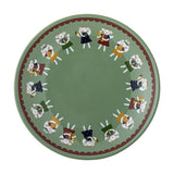 Round green stoneware plate from the Peo Christmas set, featuring a ring of winged angels playing trumpets and harps within a scalloped brown border, plain centre, on a white background.