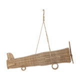 Balazar Rattan Baby Mobile in natural woven rattan, shaped as an aeroplane with wings, tail fin, propeller and wheel hoops, suspended on a cord against a white background.